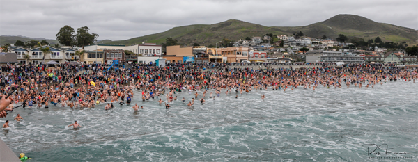 Thousands attended the annual dip in Cayucos. Photo by Rick Evans.