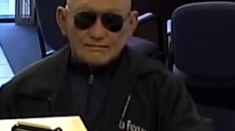 man robs bank with old man mask