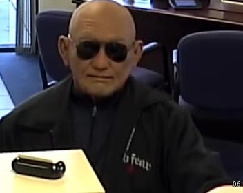 man robs bank with old man mask