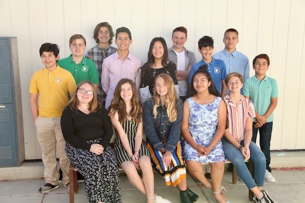 Eighth grade students graduate Almond Acres.