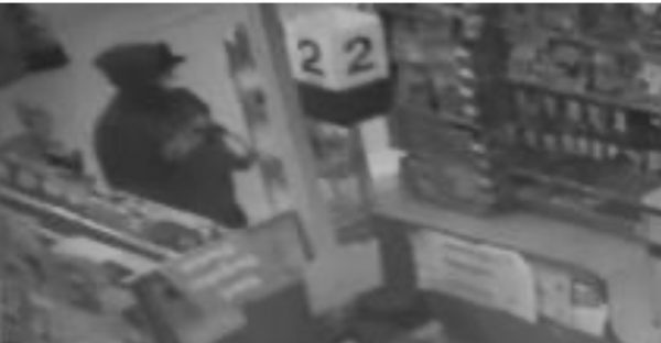 The suspect was described as a Hispanic male, 25 years old, 5’10” tall with a medium build, wearing a green hooded sweatshirt with yellow/gold colored writing on the front, black pants, black hat, and wearing a white “N95” type mask.