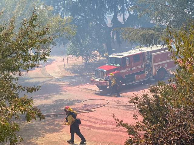 Firefighters working to stop the spread of the fire in the Capitol Hill neighborhood.