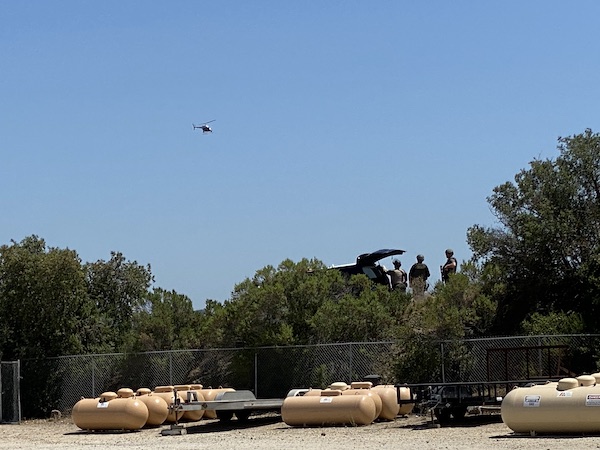 Law enforcement positioned at a post facing the Salinas riverbed behind Delta Liquid Energy on Ramada Drive in Paso Robles
