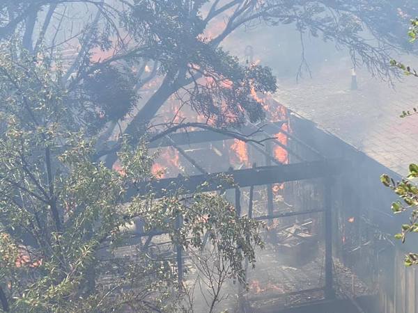 A home engulfed in flames