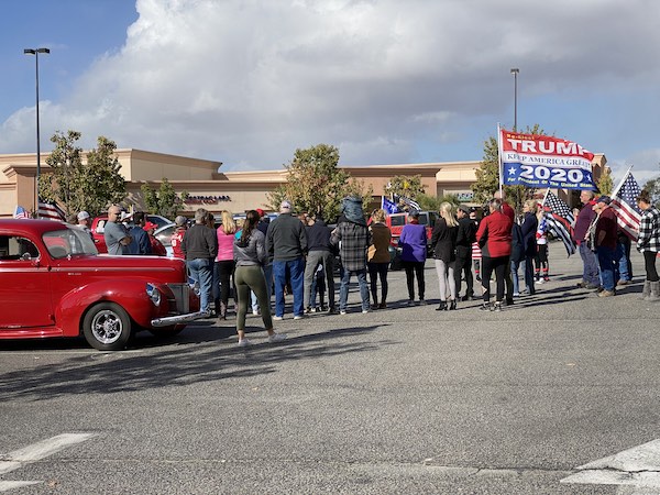 Dozens of Trump supporters gather for a prayer at the beginning of a rally on Sunday in Paso Robles