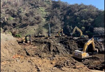 Excavators removing debris from the canyon February 11
