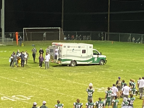 Eagles Sr Anthony Fischer loaded into ambulance