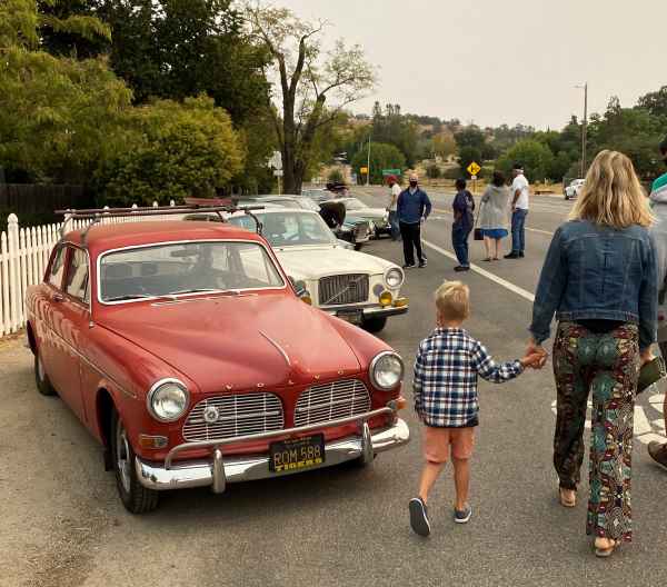 Cars and girl with son