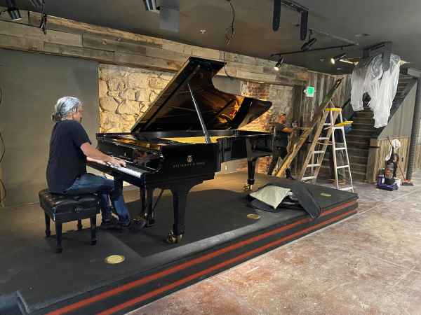 Corey at large piano playing