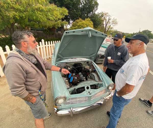 Talking shop with hood up