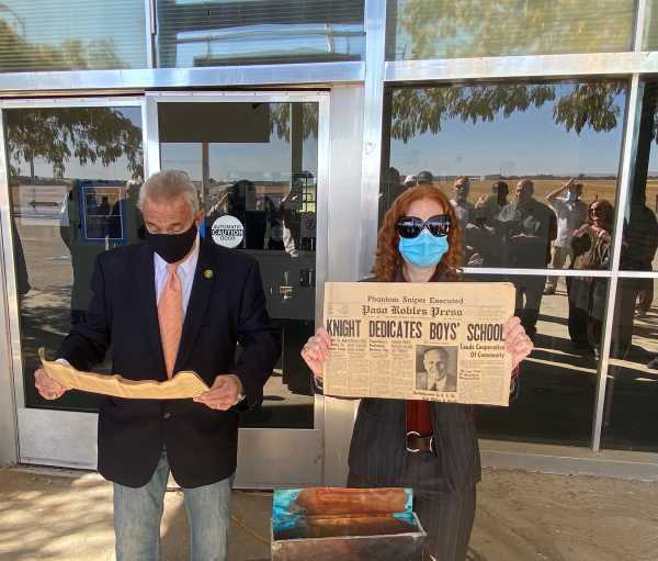 Dave Bacigalupo and Dr. Heather Bowlds examining the box's contents.