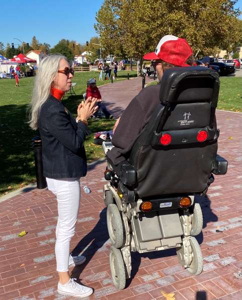Faces of Freedom Heather talking with Vet