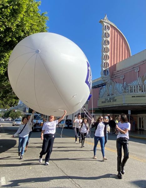 Blimp passes Fremont Theater