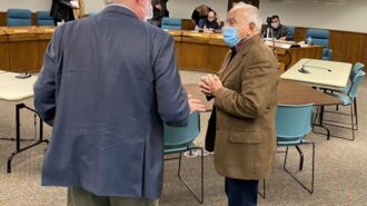 Dr. Dubost chats with Frank Triggs after selection