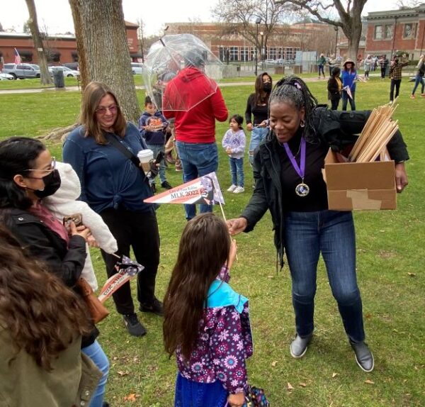 Lovella Walker hands out banners