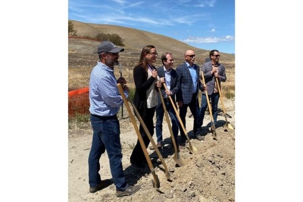 Engineeers pose on shovels