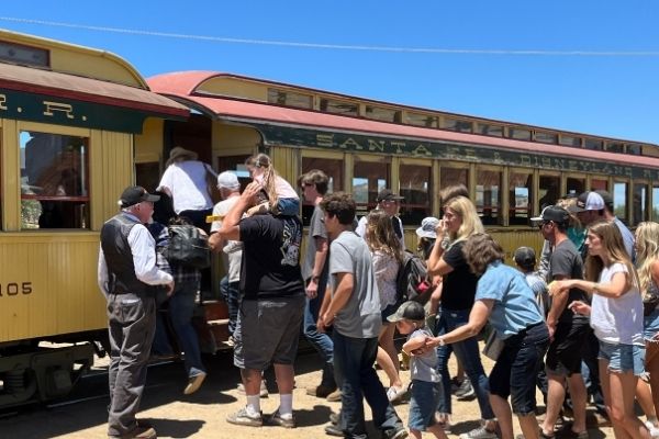 Attendees boarding train