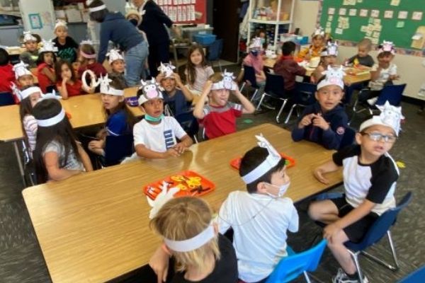 Classroom with hats on kids