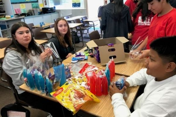 Students putting together goodie bags