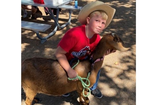 Kaden posing with goat