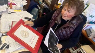 Norma at her desk