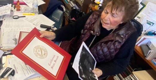 Norma at her desk