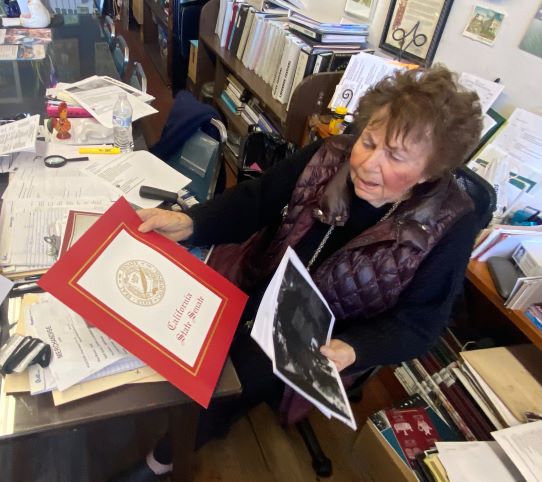 Norma at her desk