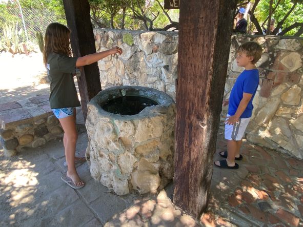 kids wishing in well