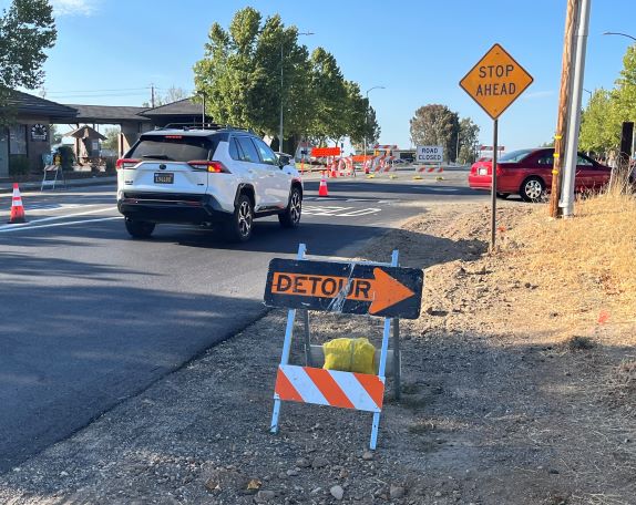 Detour with road closed sign