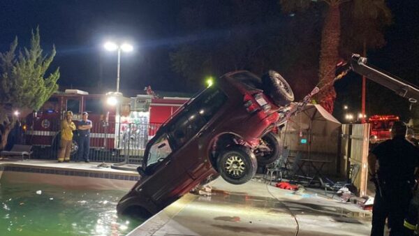 car getting pulled from pool