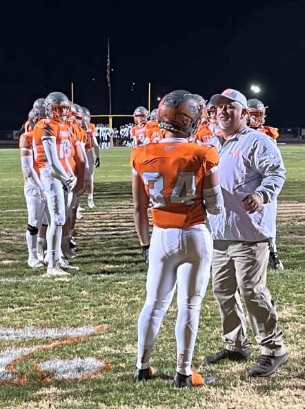 Trey Cooks gets encouragement from Coach Vic Cooper