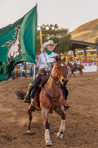 Photo information: Poly-Royal-Rodeo.jpg — 2022 Rodeo Queen Megan Sharp rides the arena prior to the competition.