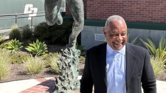 Ozzie with statue overhead