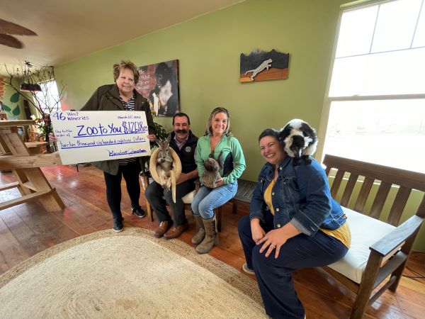 Members of Highway 46 West Wineries with kangaroo Fuzz Bucket, sloth Edward, and Lemurs Bakari.
