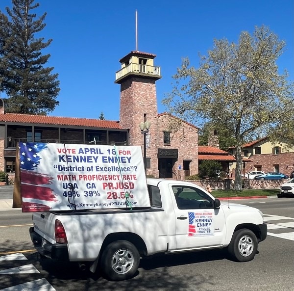 Kenny Enney Rally, truck with sign passes PR Inn
