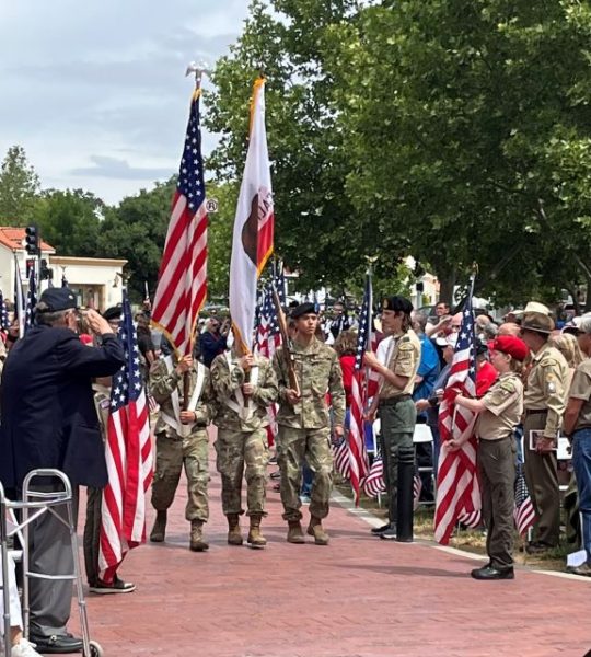 Cal Poly Color Guard enter Faces of Freedom Plaza