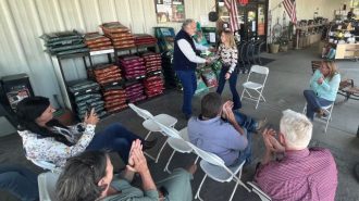 Jim Brabeck congratulates Elizabeth Reed