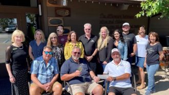 Bear McGill received the check from Gary Eberle and staff.