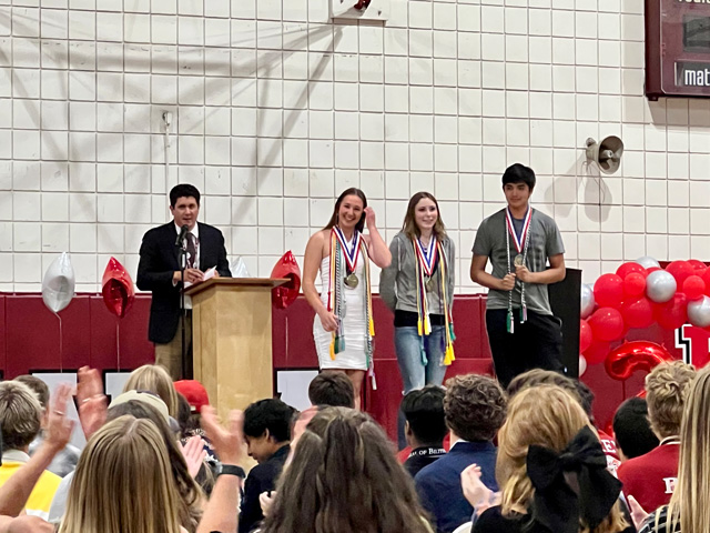 Principal Anthony Overton with seniors Olivia Wright, from left, Gwenyth Lemon, and Miguel Muniz