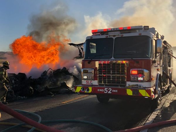 Vehicle fire ignites nearby vegetation in Shandon