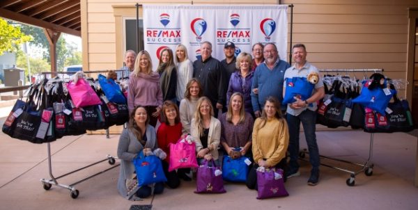 Real estate office donates cancer care packages
