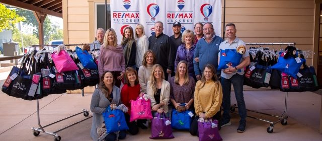 Real estate office donates cancer care packages