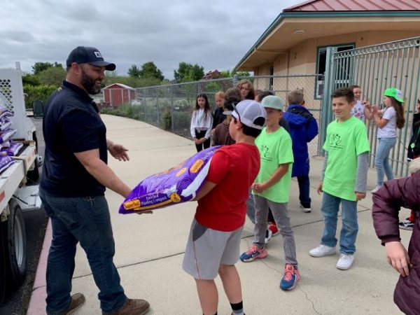 Lumber company delivers garden kits to schools
