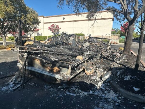Fire engulfs motor home at Home Depot, spreads to riverbed