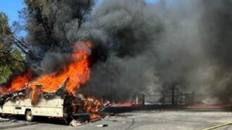 Fire engulfs motor home at Home Depot, spreads to riverbed