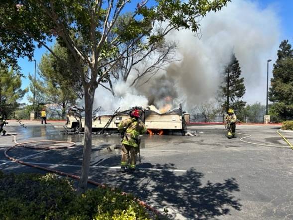 Fire engulfs motor home at Home Depot, spreads to riverbed