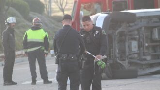 Emergency crews respond to rollover crash at intersection