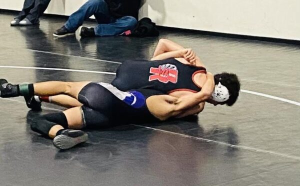 Pictured below: Gabe Morones, Chris Melgar, JV wrestling team.