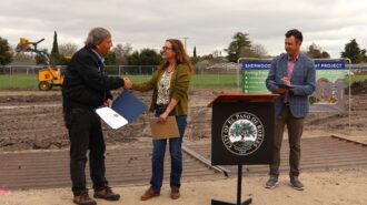 Mayor John Hamon (L) receives a proclamation from Diane Zannotti, congressional aide to Congressman Jimmy Panetta, during a groundbreaking to celebrate future improvements at Sherwood Park in Paso Robles on Wednesday, March 26, 2025.