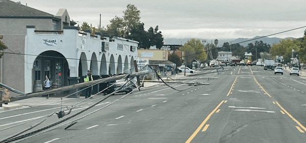 Power pole collapse blocks traffic
